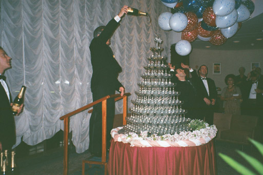 Champagne "fountain" with Matre d'Hotel Rui pouring first bottle of Champagne